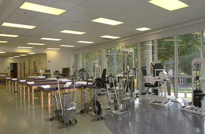 exercise room of Canter Medical Services building with a fully glassed wall and light finishes