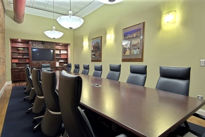 conference room featuring dark wooden built in shelving of R.W. Allen conference room 