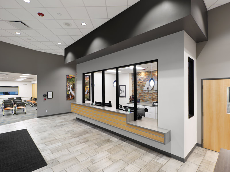 reception area and waiting area of MAU workforce solutions in Greenville done in grey tones