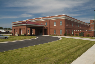 exterior shot of Curtis Baptist Church and School with covered brick side entrance 