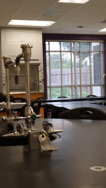 close up view of lab equipment and long desks with purple accenting in Steam lab