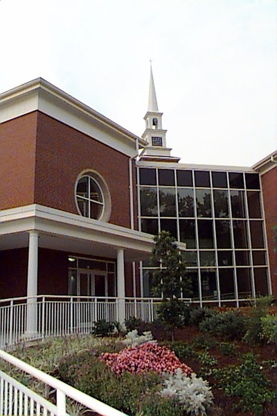 front exterior of Warren Baptist Family Life building showing floor to ceiling glass windows 