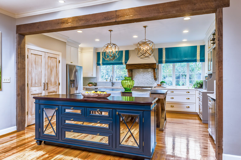 kitchen with rich wooden flooring, wooden accents, blue mirrored island and teal curtains