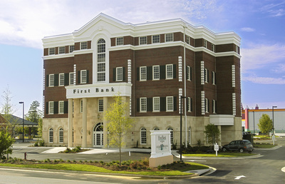 exterior shot of First Bank of Augusta's large brick and stone building