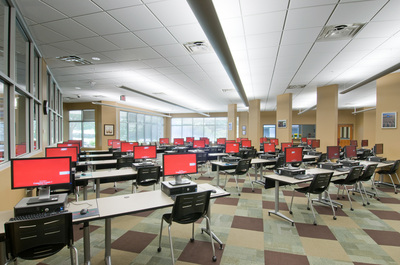 technology area of Nancy Guinn Memorial Library with desks, chairs and computers