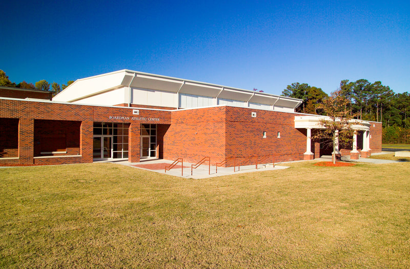 exterior shot of lighted Augusta Preparatory Day School library at dusk