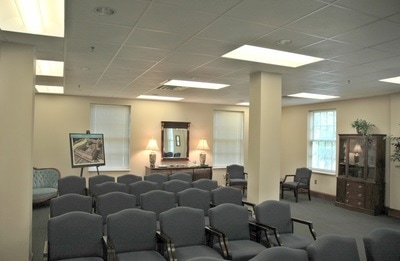 seating section with grey upholstered chairs in conference room of Lewis Hall at Georgia Southern University 