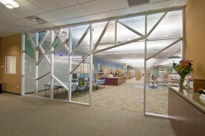 geometric windows leading into main circulation area of Nancy Guinn Memorial Library 