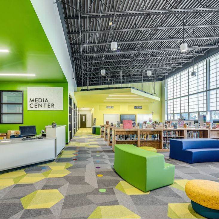 Richmond Hill K-8 Replacement School media center with colorful interiors 