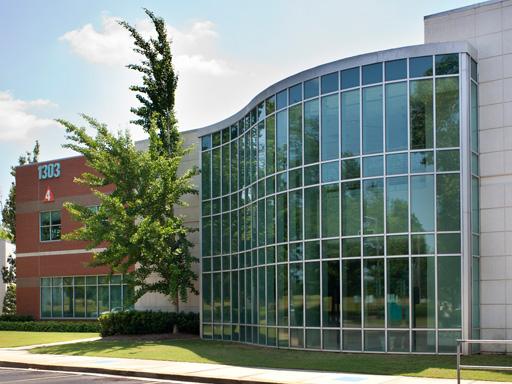 University Professional Office Building Four side view featuring glass wall on cement brick facing adjacent to red brick composition 