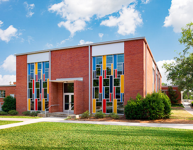 exterior shot of Williams Center office of student activities  and student organization resource center featuring large Mondrian windows