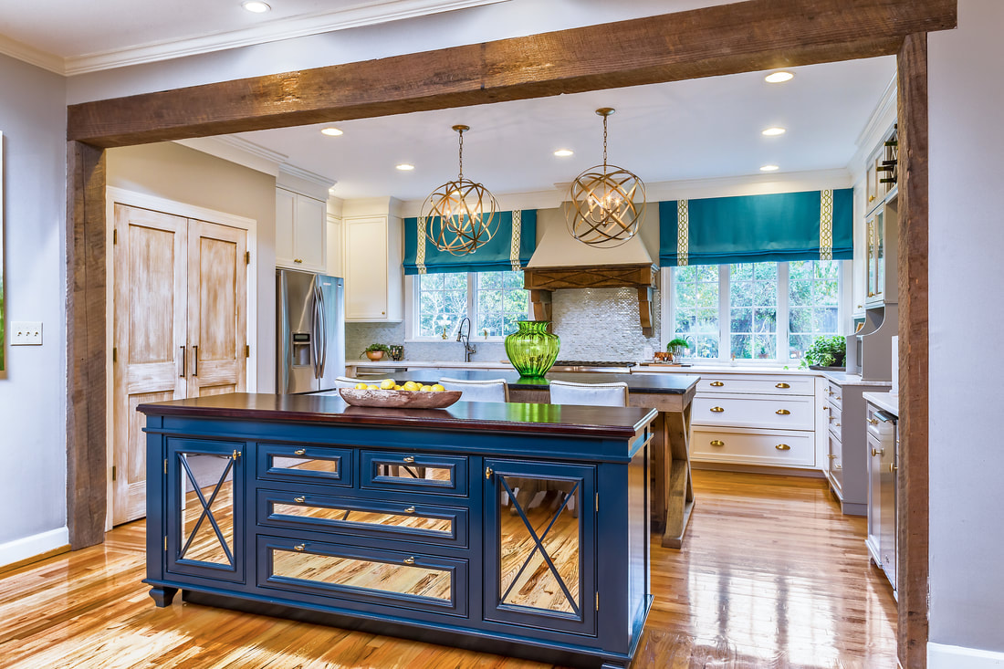 shot of Hagler residence kitchen with bright lighting, wood, mirrored, blue accents