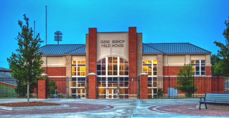 Exterior of Gene Bishop Field House at Georgia Southern University done in brick and stucco with large middle window section