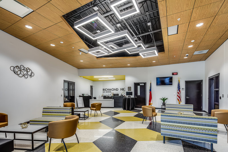 new Richmond Hill K-8 Replacement School front office with colorful geometric flooring and geometric lighting 