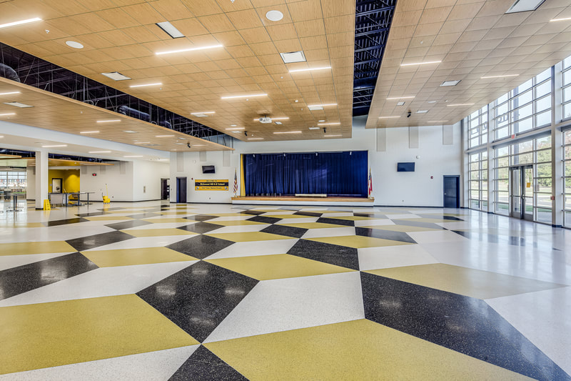 new Richmond Hill K-8 Replacement School common/entry space with colorful geometric flooring 