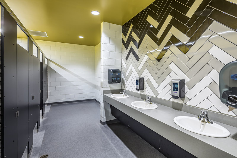 new Richmond Hill K-8 Replacement School bathroom with geometric patterned tile wall 