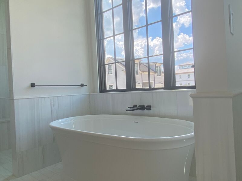bathtub with large overlooking window